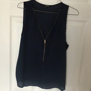 Navy blue blouse with gold zipper.